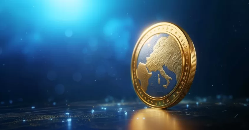 Zlatá mince s vyraženou mapou Evropy